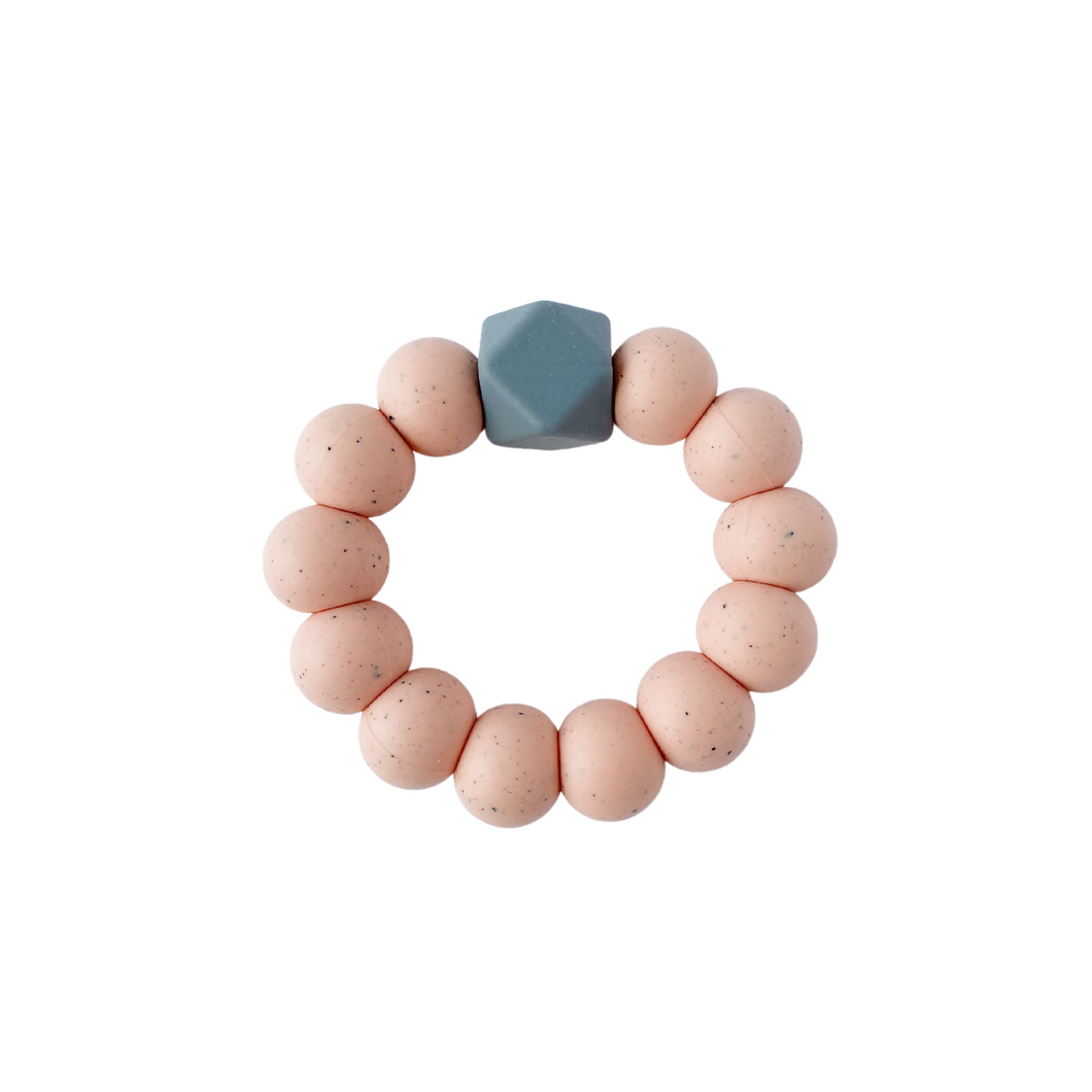 Peach speckled teething ring